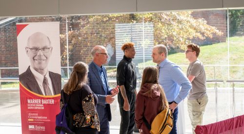 warner baxter with students at ethics day, main image for newsletter